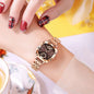 Alcom Distribution rose gold luxury women's watch with brown sunburst dial and geometric bezel on wrist