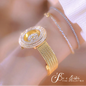 Alcom Distribution hot-selling ladies quartz watch gold mesh band with crystal encrusted round dial on wrist