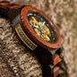 BOBO BIRD men's mechanical wood watch with wooden bezel and skeleton dial on textured bark surface