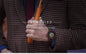 BOBO BIRD men's mechanical wood watch worn on wrist with checkered blazer and wooden flute