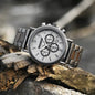 Alcom Distribution sustainable watches for men with metal band and chronograph display on natural wood background