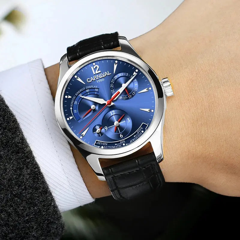 CARNIVAL men's automatic watch blue dial, silver case, black leather strap on wrist with dress shirt