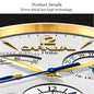 CARNIVAL men's automatic watch close up white dial with gold logo at 12 gold bezel blue hands and subdials