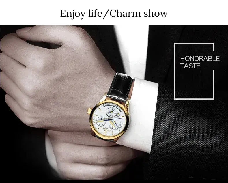 CARNIVAL men's automatic watch gold case white dial black leather strap on suited wrist by Alcom Distribution