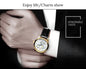 CARNIVAL men's automatic watch gold case white dial black leather strap on suited wrist by Alcom Distribution