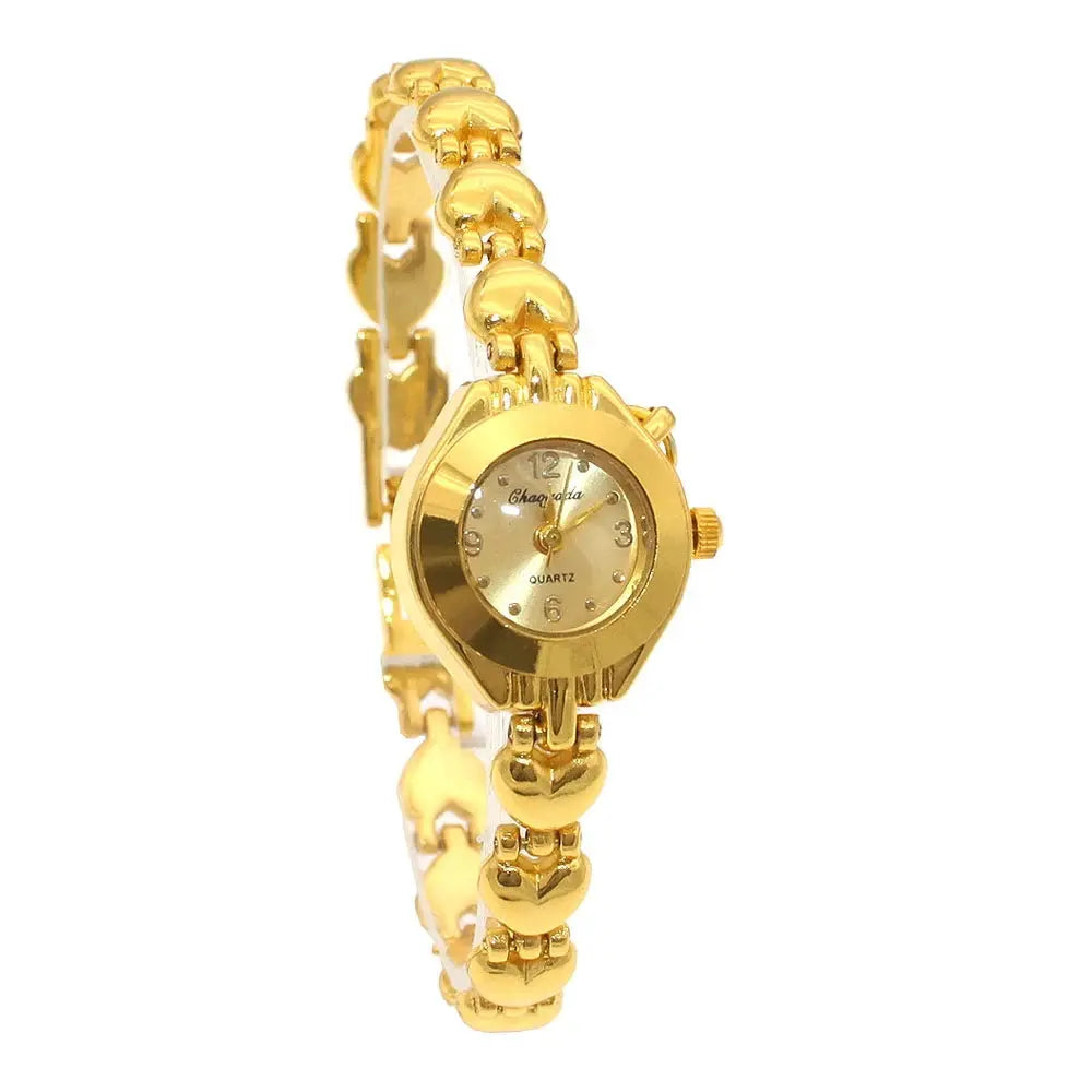 Alcom Distribution gold bracelet watch for women with heart-shaped links and a round gold dial