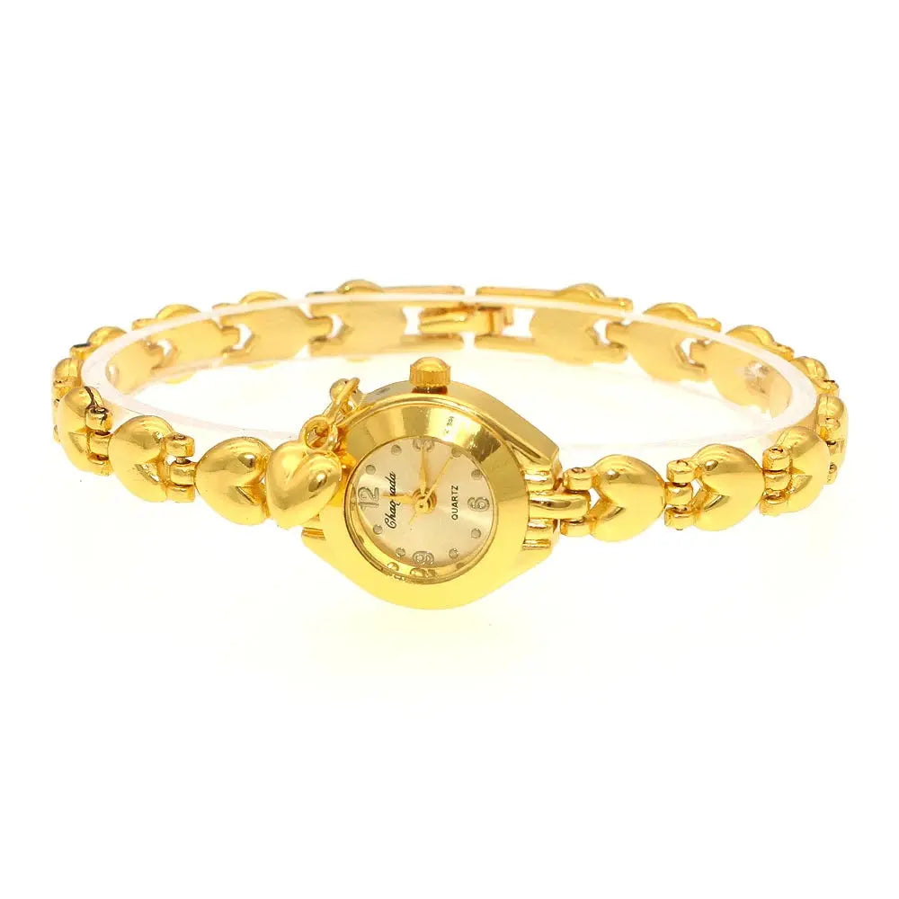 Gold bracelet watch for women with heart-shaped links and a round gold dial by Alcom Distribution
