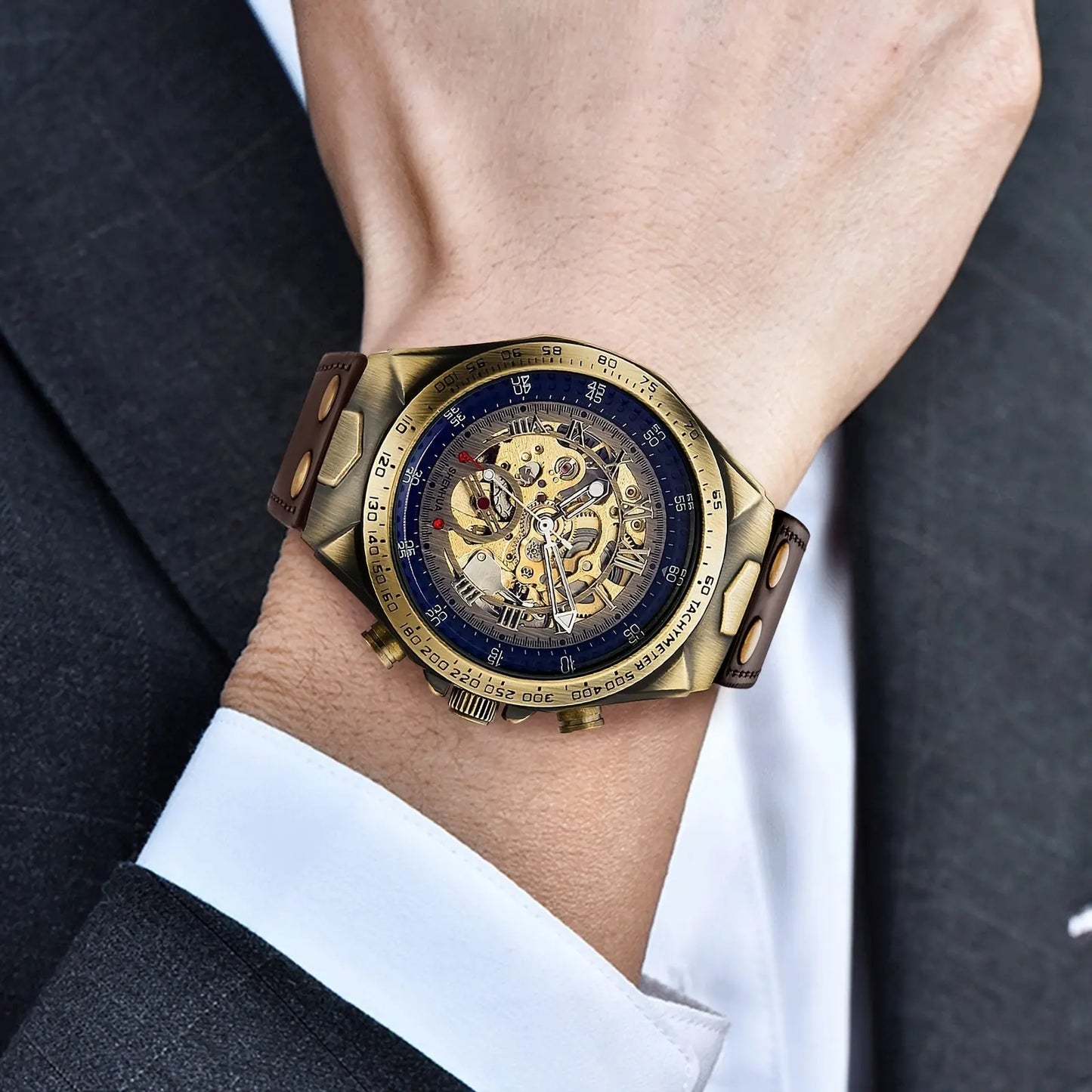Alcom Distribution classic style automatic watch with gold skeleton dial and brown leather strap on wrist