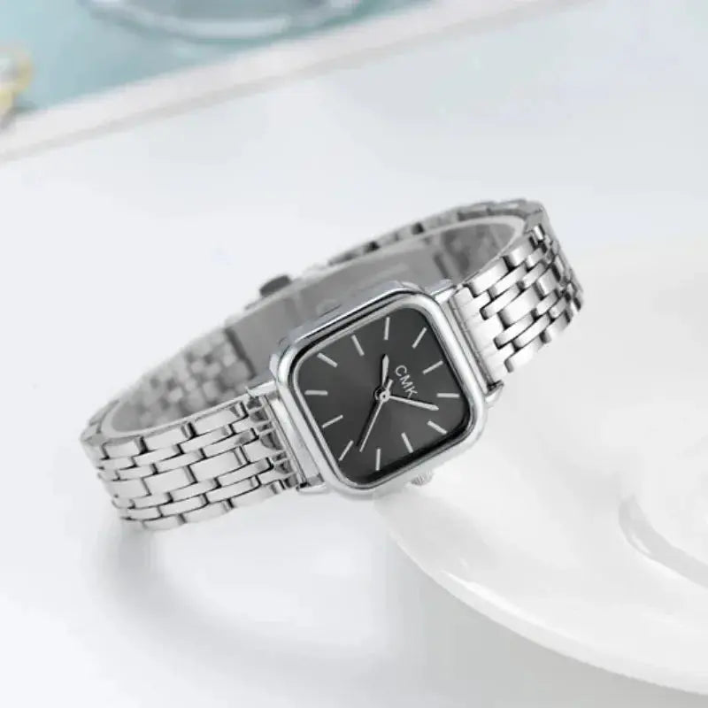 Alcom Distribution square quartz watch for women with silver metal band and black face