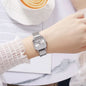 Silver square quartz watch for women with metal link band on wrist by Alcom Distribution