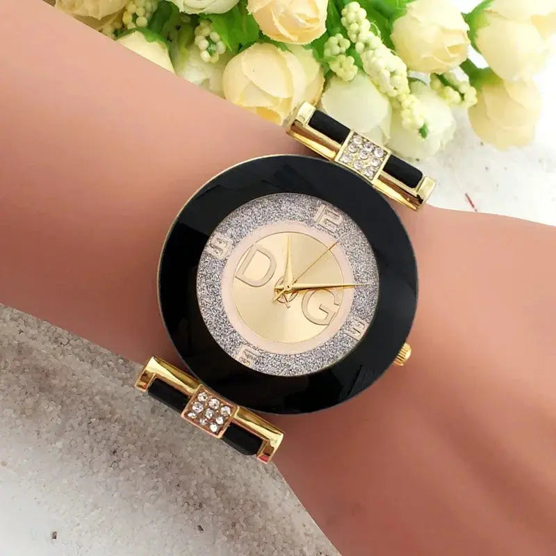 Elegant quartz watch for women with black and gold design and crystal accents by Alcom Distribution