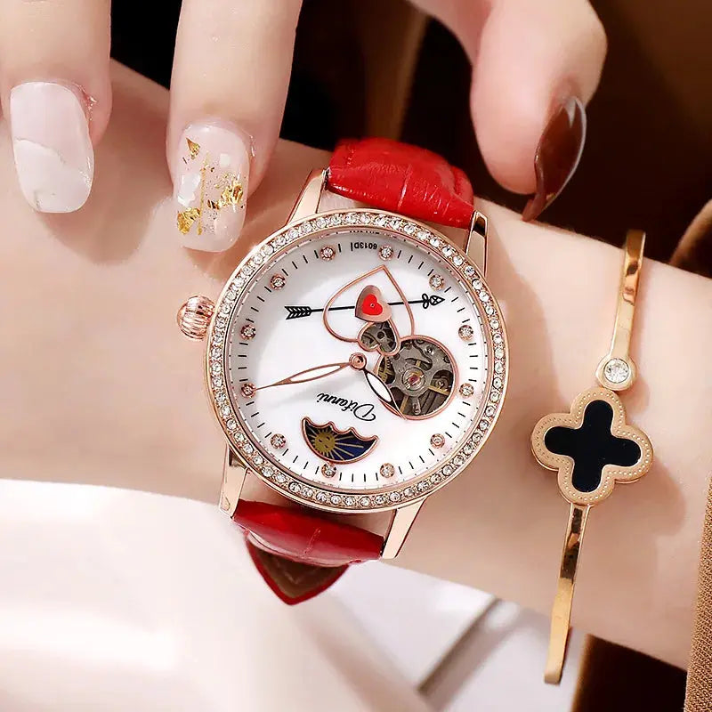 Alcom Distribution women's luxury automatic watch with red strap and decorative heart dial