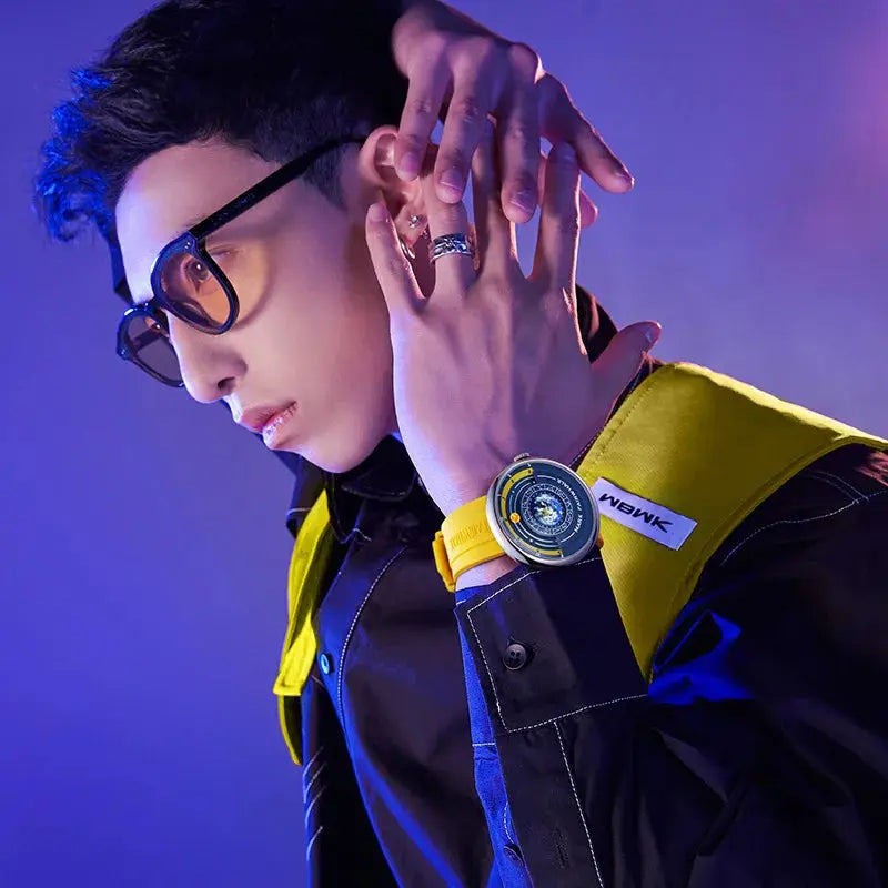 Alcom Distribution model wearing a yellow and black luxury quartz men's wristwatch with modern dial and sporty strap