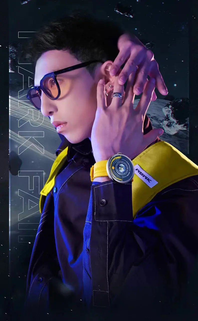 Male model in yellow jacket wearing luxury quartz men's wristwatch with bold yellow strap and rings