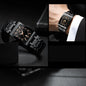 Alcom Distribution black rectangular watch with rose gold dial accents on metal bracelet luxury men's quartz watch