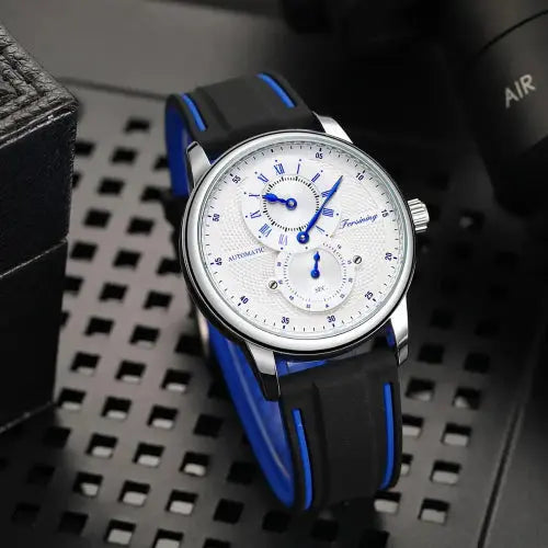 Alcom Distribution automatic mechanical sport watch for men silver case white dial blue hands subdials black silicone strap