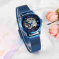 Elegant mechanical timepiece for women with blue mesh band and exposed gears by Alcom Distribution