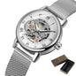Elegant mechanical timepiece for women with silver mesh band and visible gears by Alcom Distribution