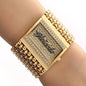 Alcom Distribution gold rectangular quartz analog women's watch with crystal bezel and wide bracelet band