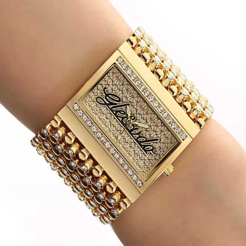 Alcom Distribution wide gold crystal bracelet quartz analog women's watch with rectangular jeweled dial