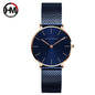 Hannah Martin rose gold watch with blue mesh strap and minimalist dial by Alcom Distribution