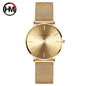 Hannah Martin rose gold watch with mesh strap and minimalist dial design