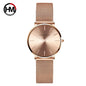 Hannah Martin rose gold watch with mesh strap and minimalist dial design by Alcom Distribution