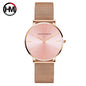 Hannah Martin rose gold watch with mesh band and minimalist pink dial from Alcom Distribution