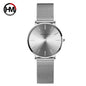 Hannah Martin rose gold watch with minimalist silver dial and mesh strap from Alcom Distribution