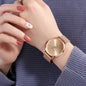 Hannah Martin rose gold watch on wrist with mesh band and simple dial design by Alcom Distribution