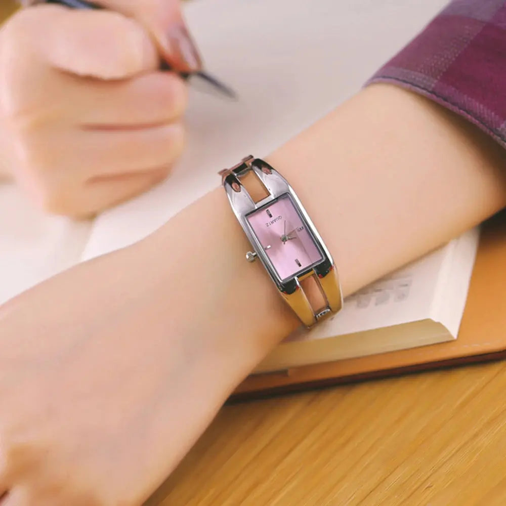 Alcom Distribution luxury women's bracelet watch pink rectangular dial two tone metal bracelet on wrist