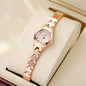 Alcom Distribution rose gold ladies bracelet watch on cream display cushion with slim linked band