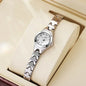 Alcom Distribution rose gold ladies bracelet watch displayed in polished silver tone with white dial on cushion