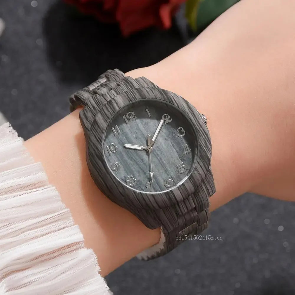 Alcom Distribution luxury wood grain watch with textured black wooden band on wrist