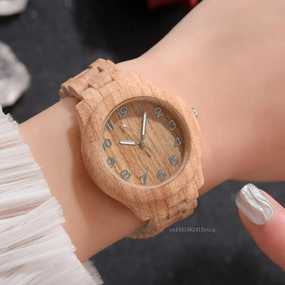 Alcom Distribution luxury wood grain watch in light wood tone worn on wrist with silver nail polish