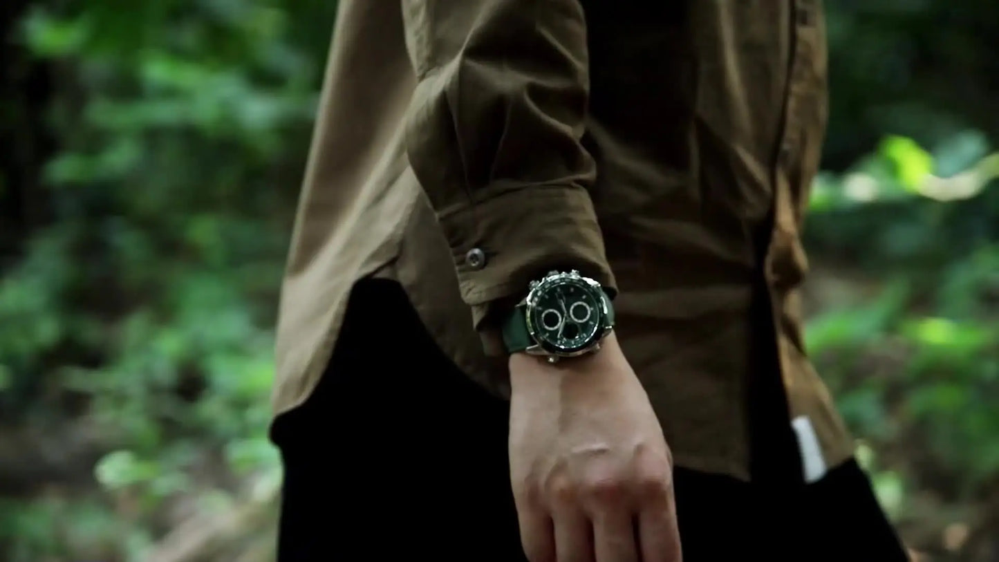 Leather waterproof watch for men worn on wrist with dark green dial and chronograph features