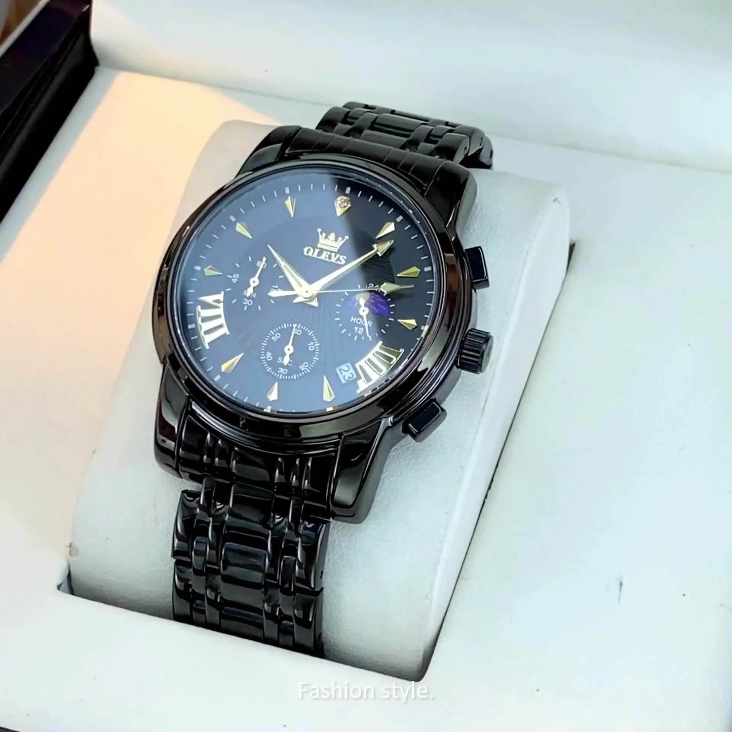 OLEVS waterproof quartz watch in black with metal band and chronograph features by Alcom Distribution