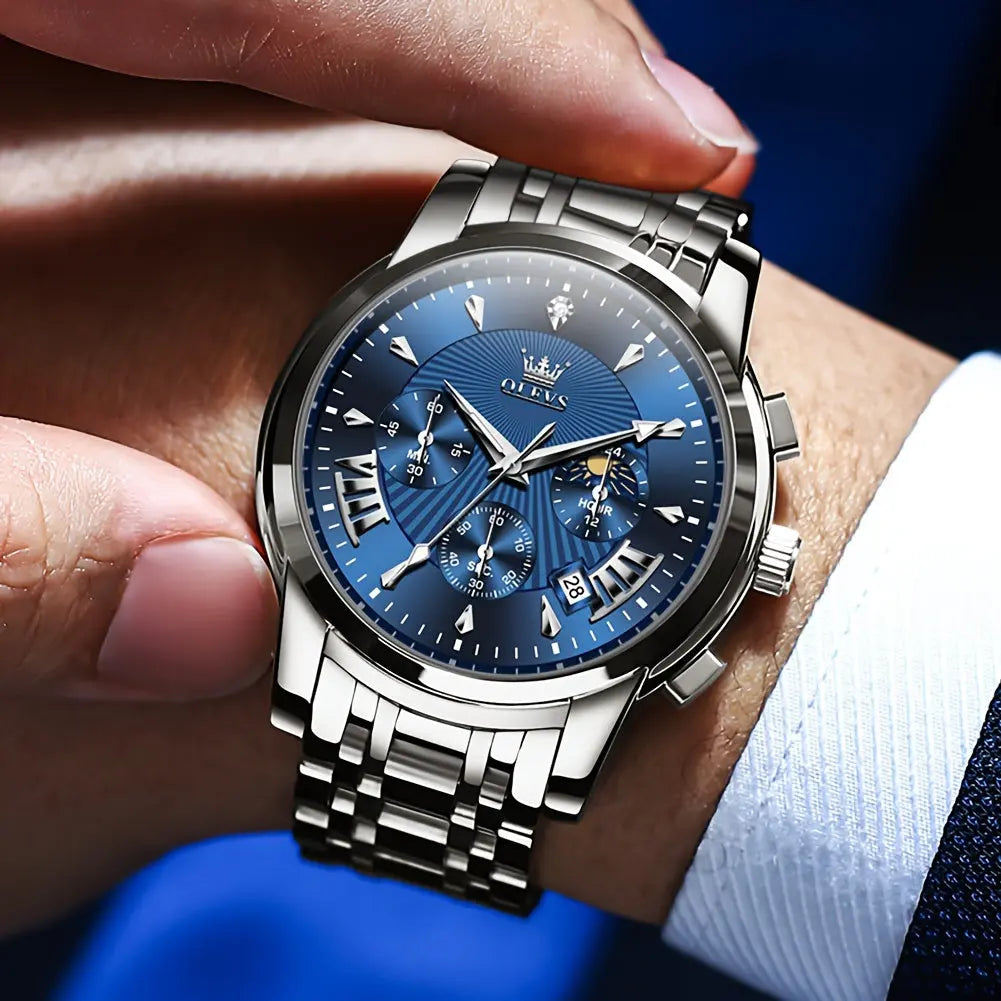 OLEVS waterproof quartz watch with blue dial and silver metal strap on wrist