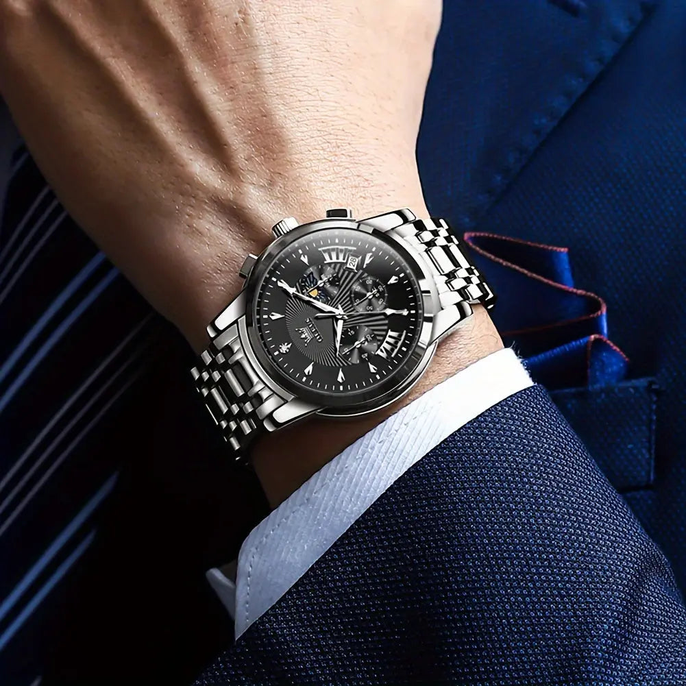 OLEVS waterproof quartz watch with silver metal band and black dial worn on wrist by man in blue suit