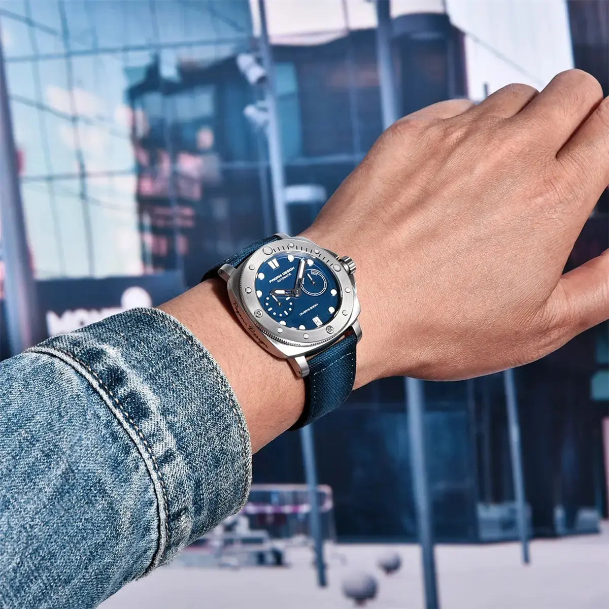 Pagani Design diver watch with blue dial and leather strap worn on wrist in urban setting
