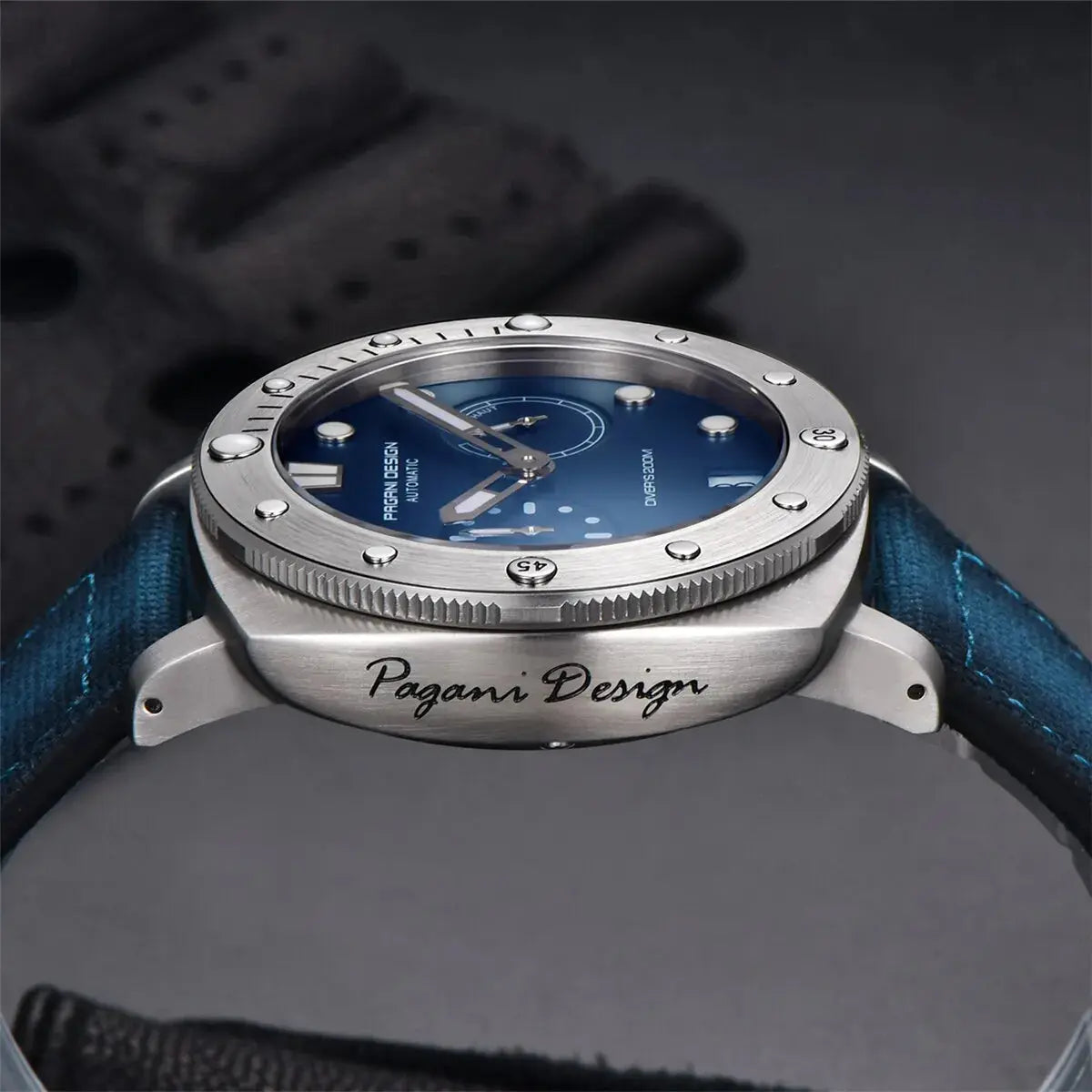 Pagani Design diver watch with stainless steel case and blue dial on blue strap by Alcom Distribution