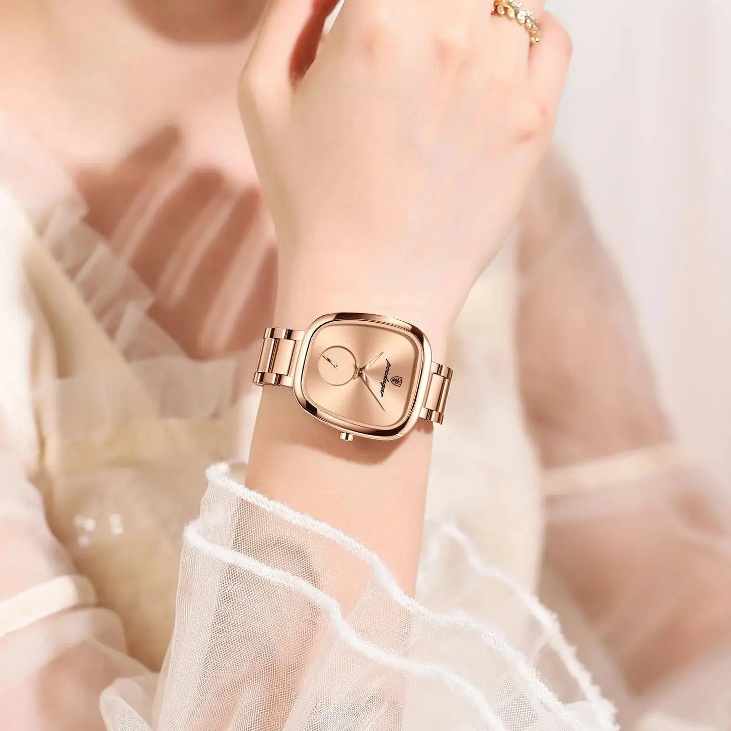 Fashionable quartz timepiece for women with a rose gold square dial and metal bracelet by Alcom Distribution