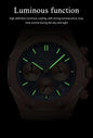 Alcom Distribution men's quartz chronograph watch with luminous green hands and hour markers on a dark dial with three subdials