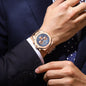 Alcom Distribution men's quartz chronograph watch rose gold bracelet with blue textured dial on wrist