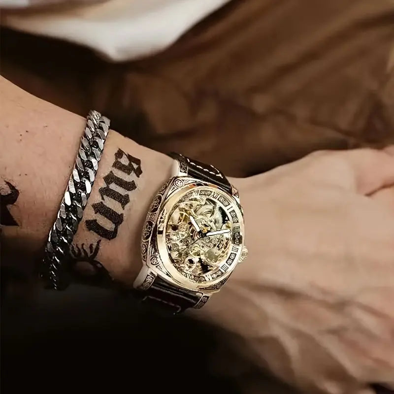 Premium men's watch with mechanical movement featuring intricate gold dial and black leather strap on wrist