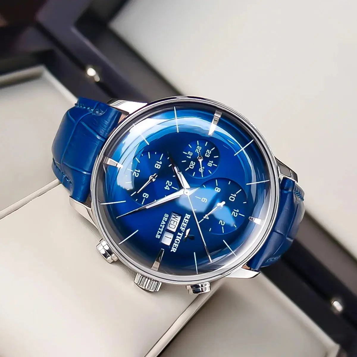Reef Tiger luxury men's watch with blue dial and matching leather strap by Alcom Distribution