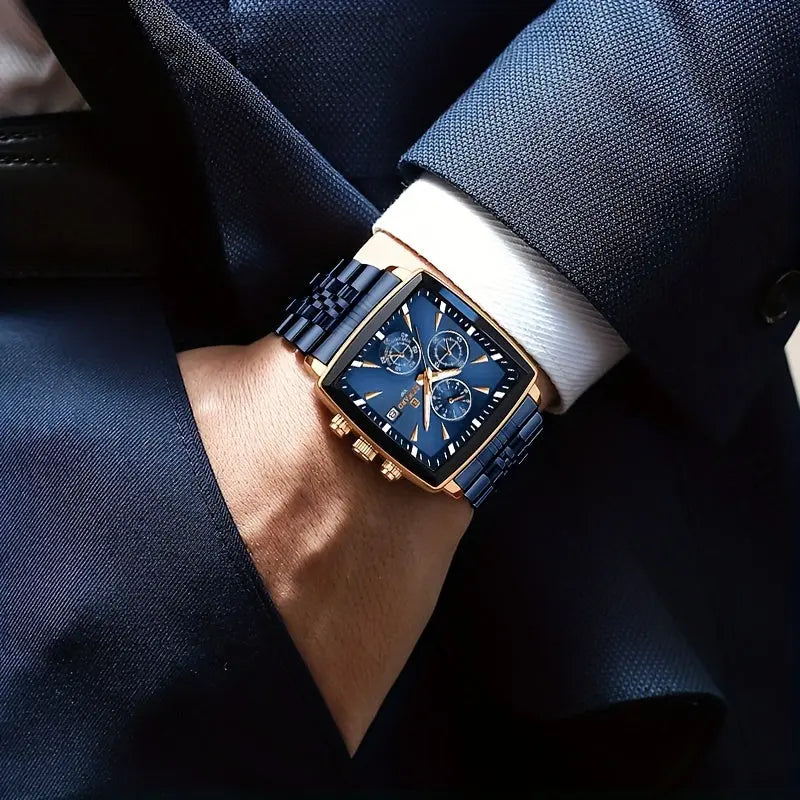Men's blue rectangular watch with gold accents and metal band by Alcom Distribution worn with navy suit
