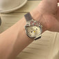 Alcom Distribution hello kitty diamond watch silver mesh band with pink crystal bow on wrist