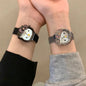 Alcom Distribution hello kitty diamond watch on two wrists showing black and silver mesh bands jeweled bow and Hello Kitty face