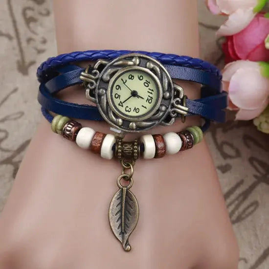 Shourui quartz wristwatch for women with blue leather strap and decorative bead charm bracelet